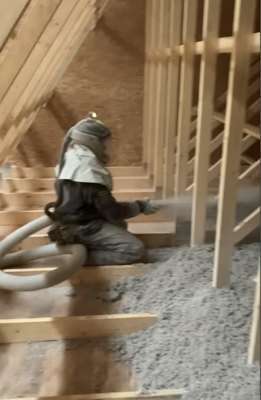 Blown-in insulation being installed into a wall cavity in a Surprise, AZ home