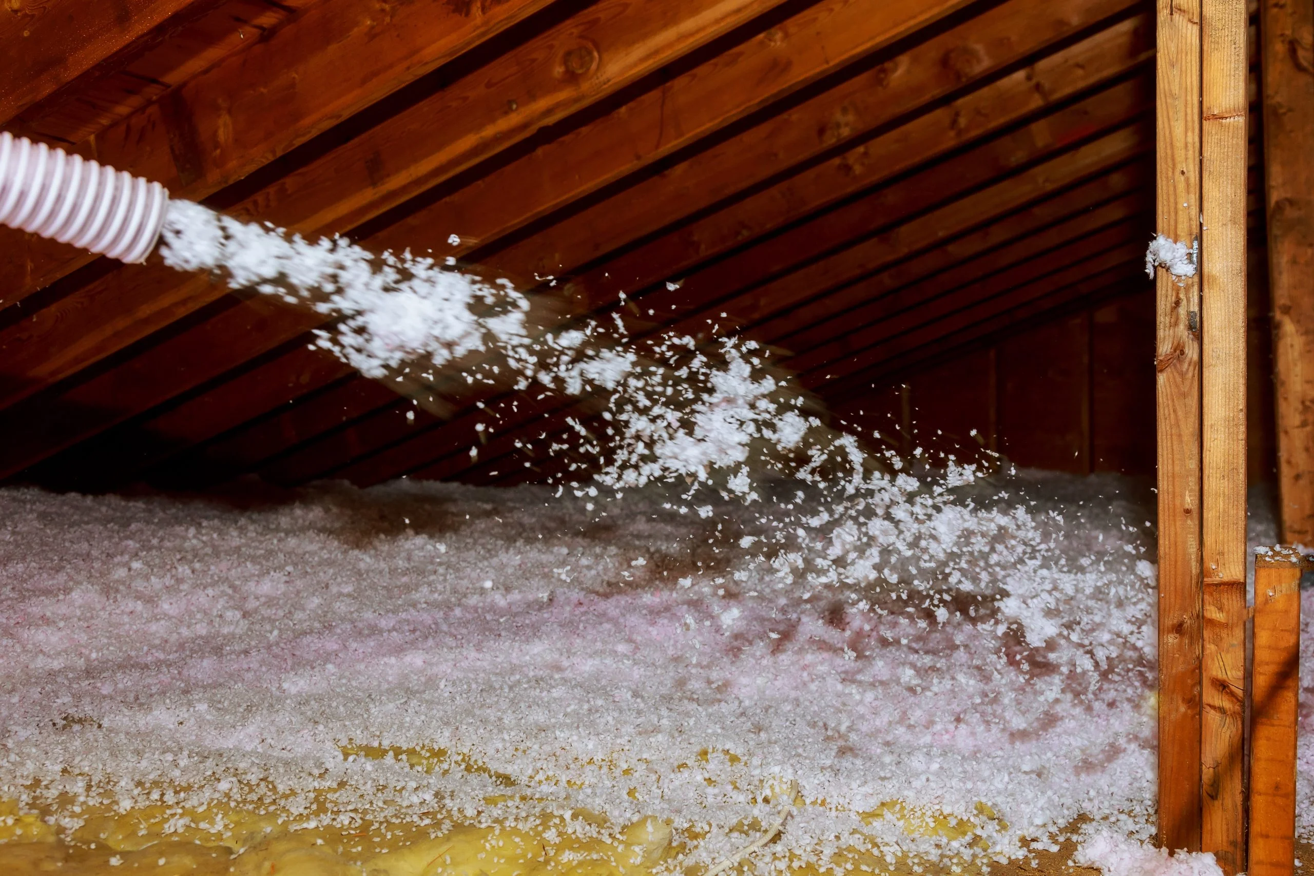 Blown-in insulation being installed in a home attic in Surprise, AZ