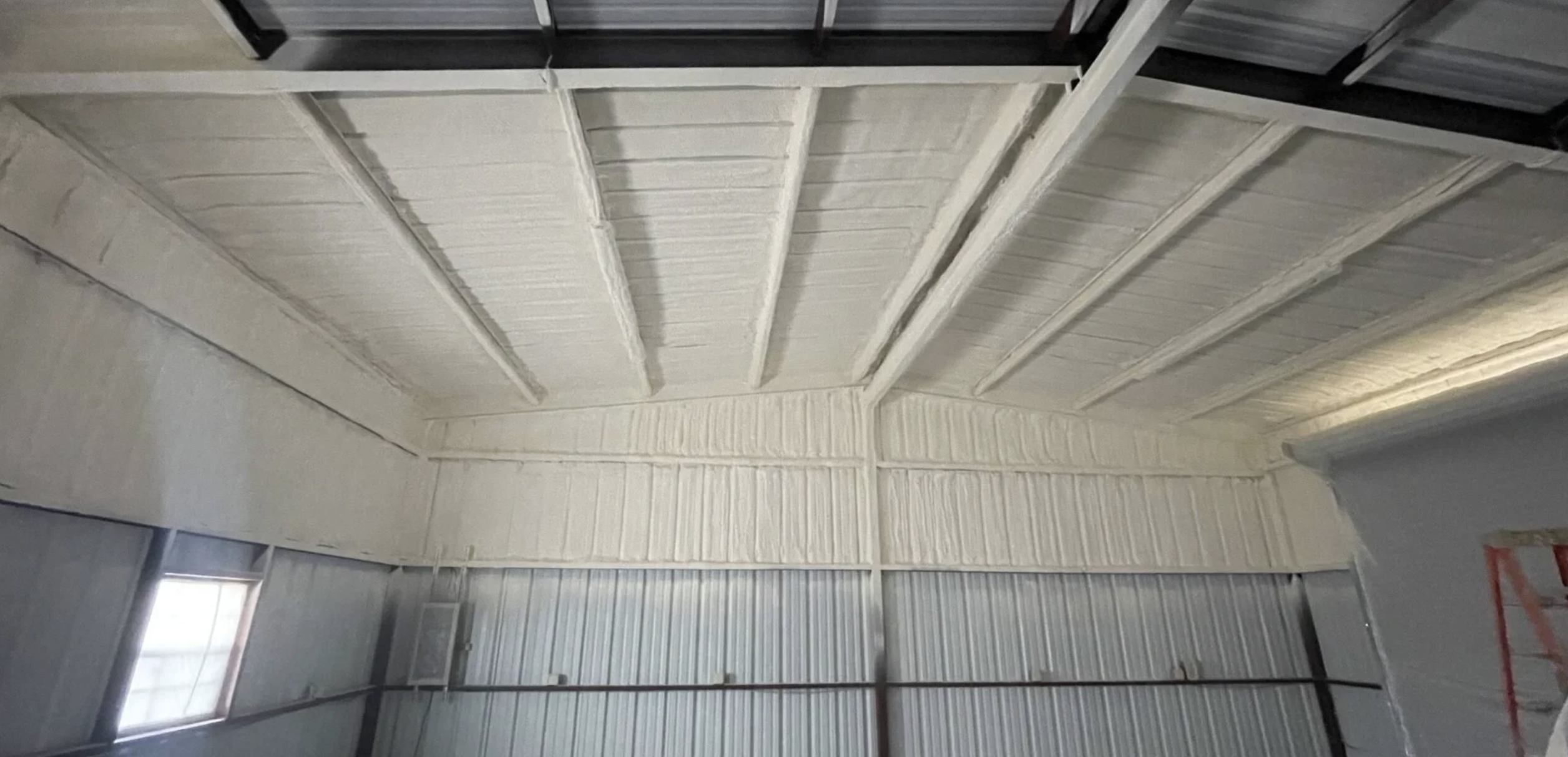 Commercial building interior prepared for spray foam insulation in Surprise, AZ