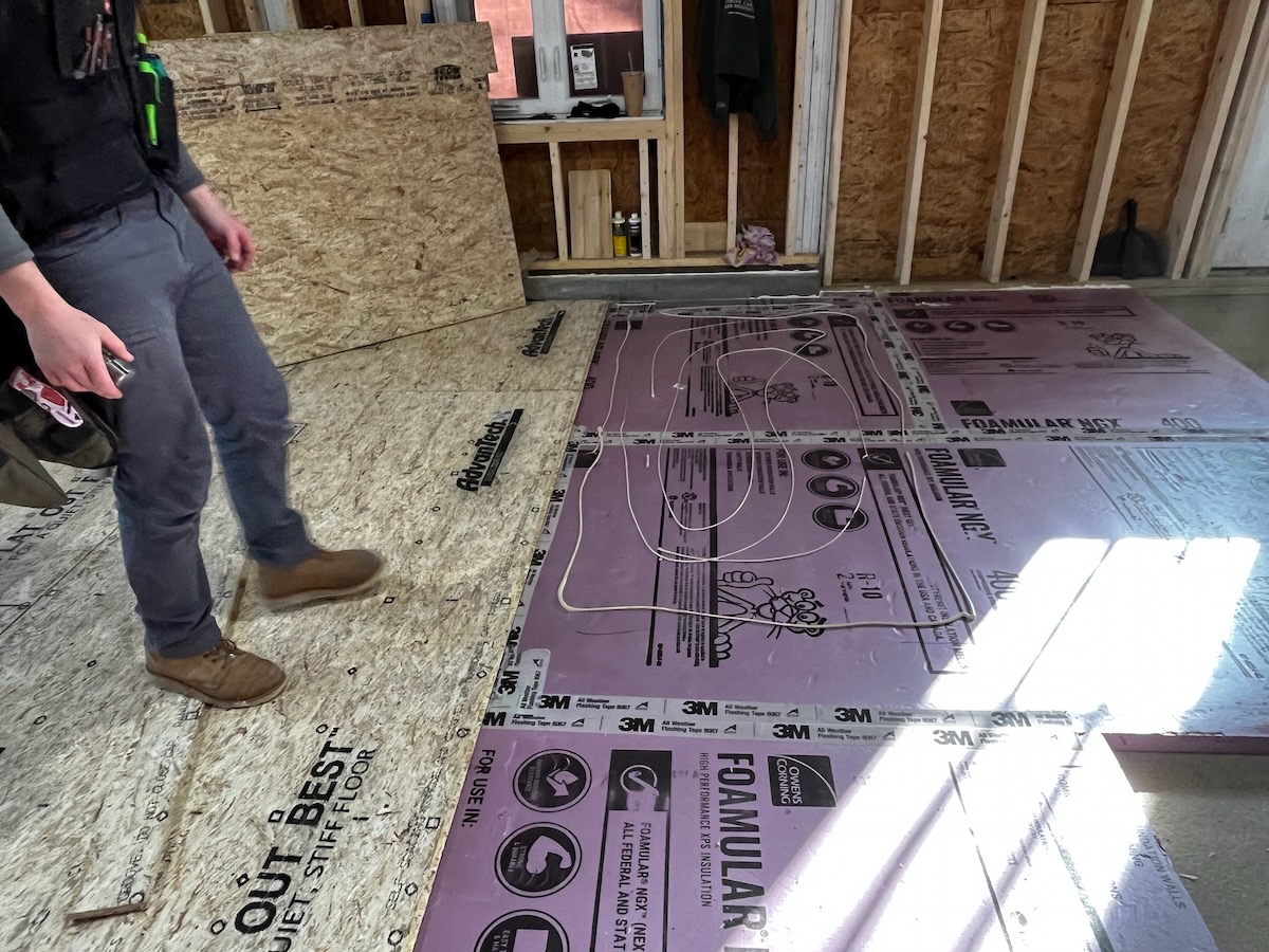 Rigid foam floor insulation installed over a subfloor in Surprise, AZ
